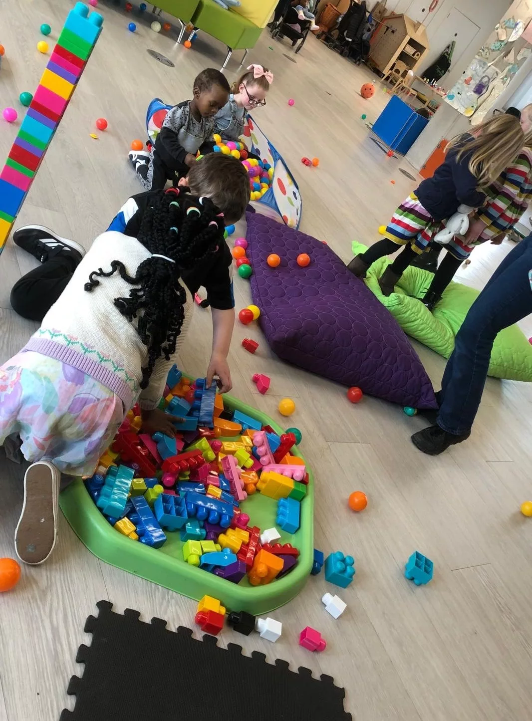 children playing at a creche event